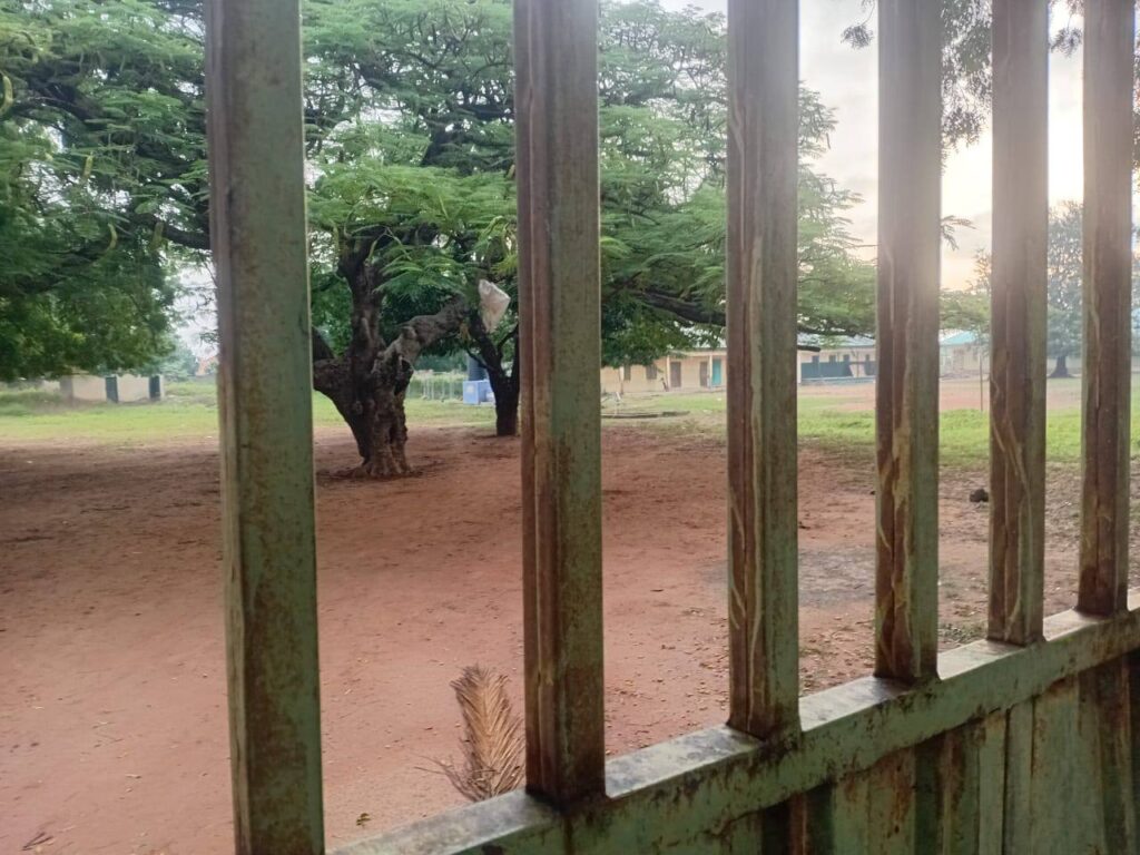 a locked gate of a public school during a teachers' strike